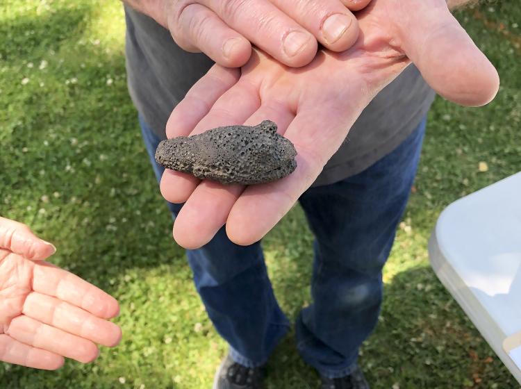 An event visitor shares an artifact they brought to the 2019 Harney County Archaeology Roadshow; photo by Lyssia Merrifield