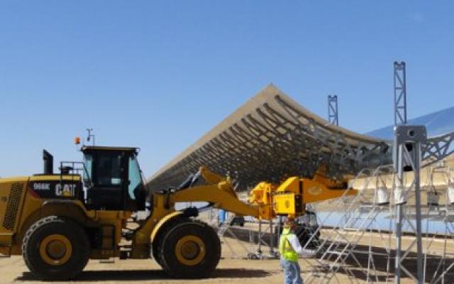 Construction vehicle installing solar panels