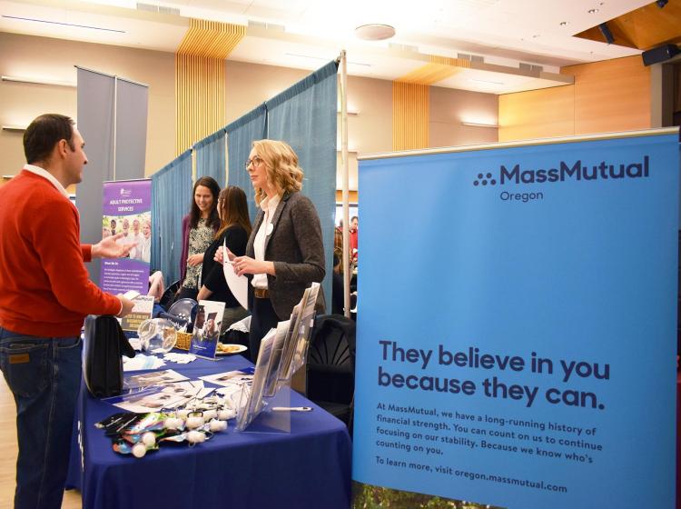 Mass Mutual Recruiter talking with interested students