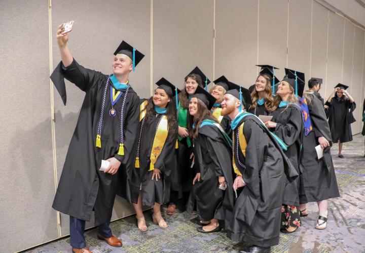 Photo of students in graduation gowns