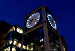 Urban center clock at night