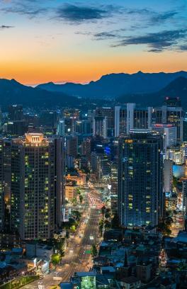 Seoul, South Korea cityscape with mountains behind