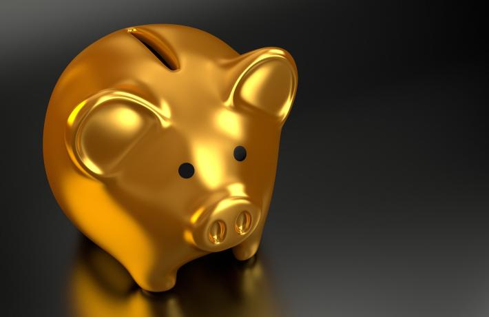 Close up of gold piggy bank