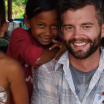 Man with kids, smiling