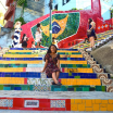 woman sitting on brightly colored steps