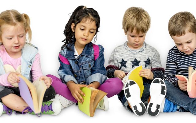 Children sitting on the floor reading