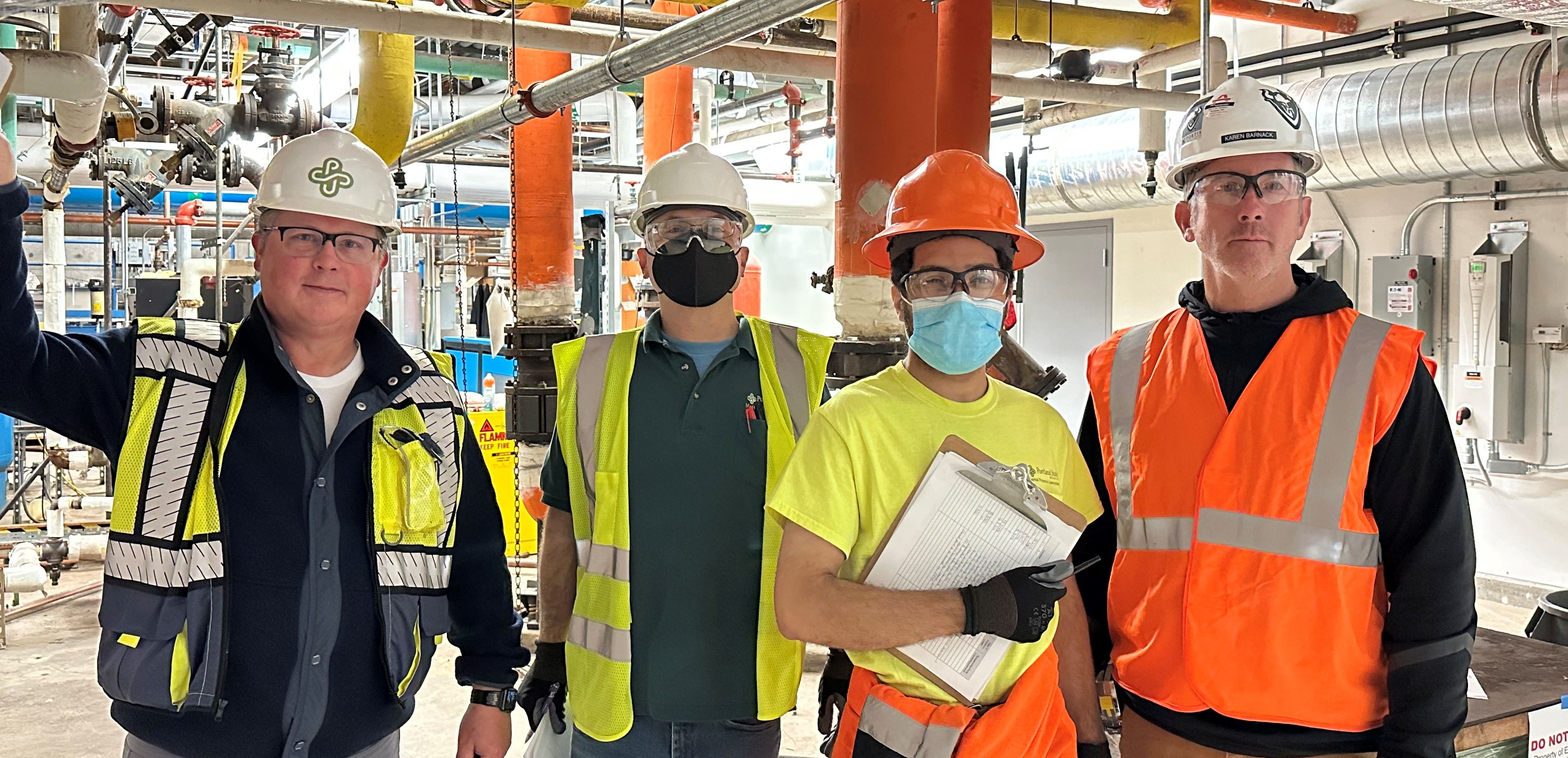 Group of workers in Personal Protective Equipment