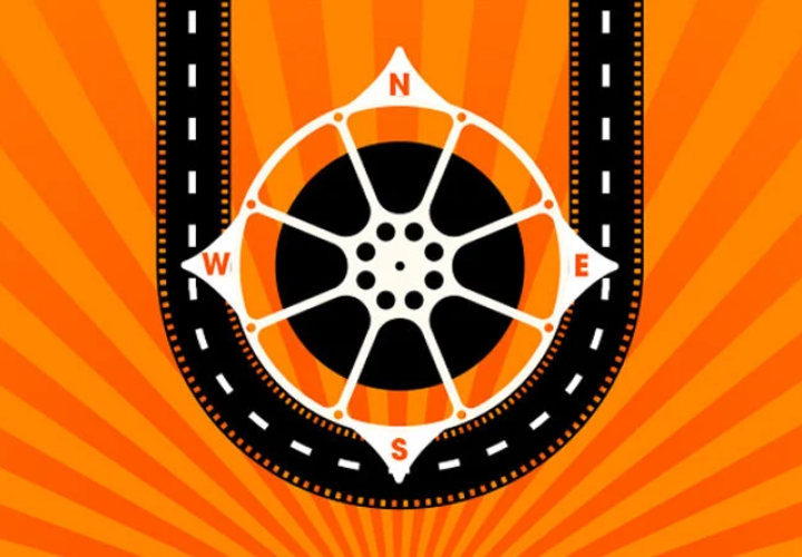 A compass styled like a film reel in the center with a dotted road curving around the compass