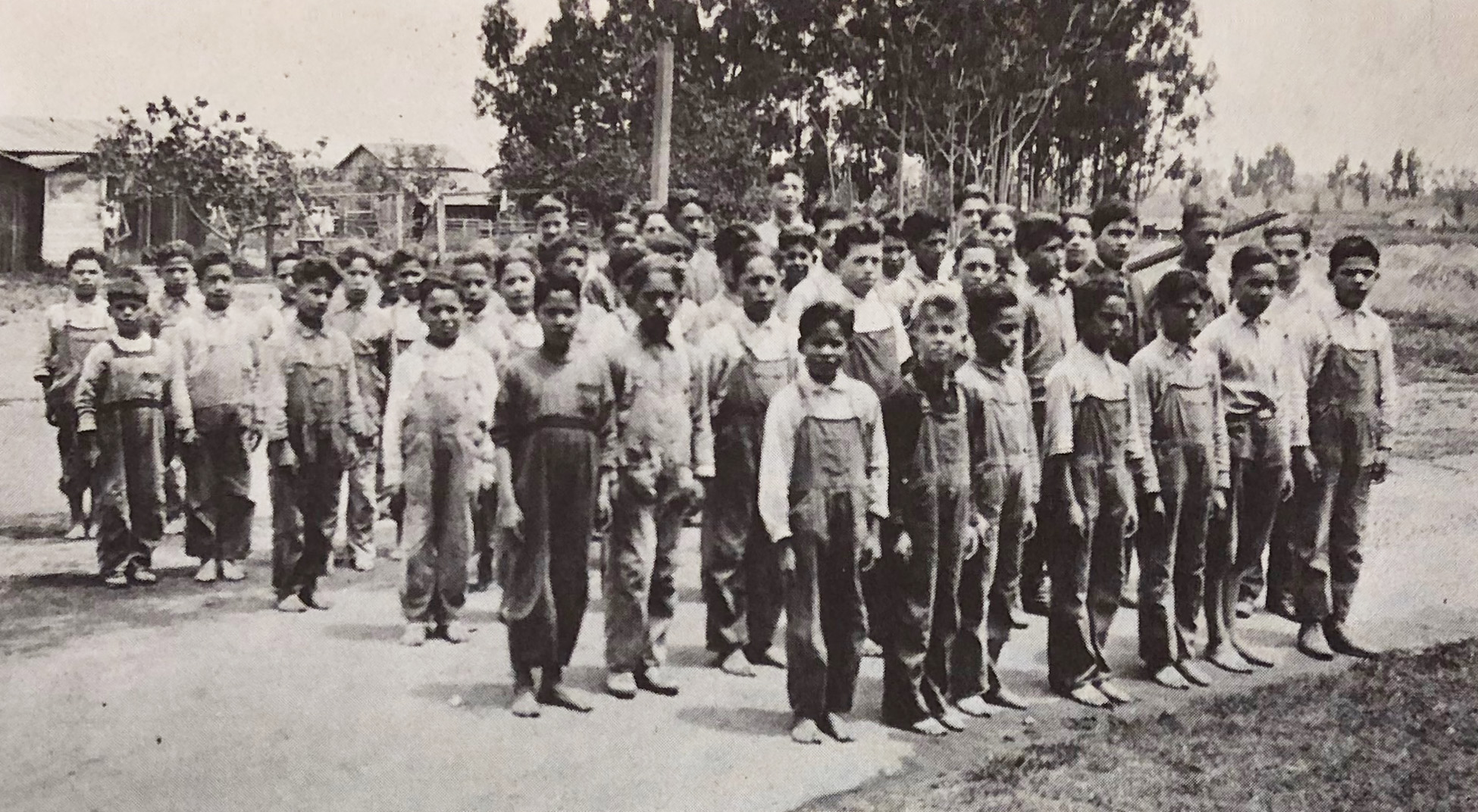 Mexican and Mexican American boys lined up at a boarding school in Gardena, CA in the 1920s