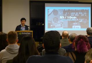 Yamato Watanabe presenting a lecture