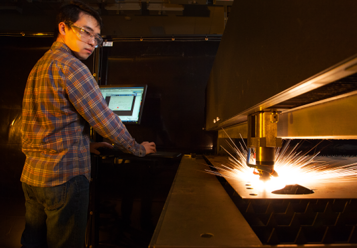 Student working with 600 watt laser