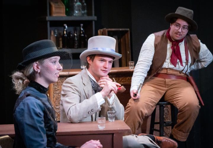 Good Country characters conversing at a saloon