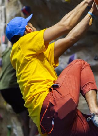 person climbing on rock wall