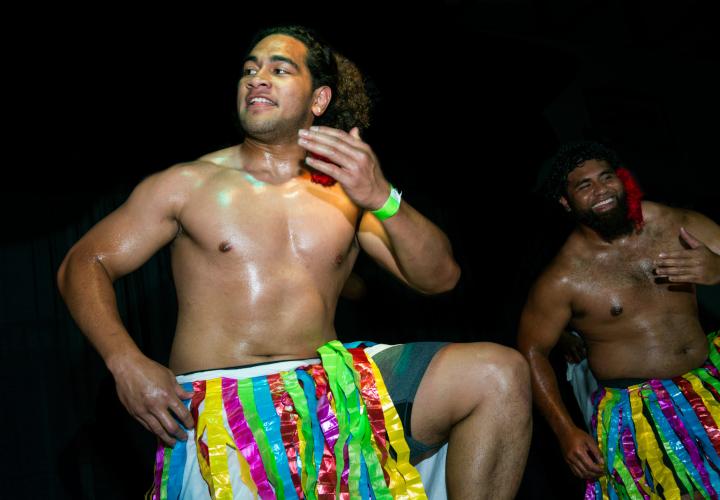 man dancing in luau
