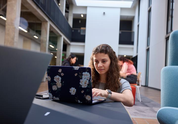 PSU student using a laptop
