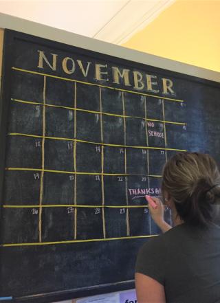 Chalkboard with a calendar of events.