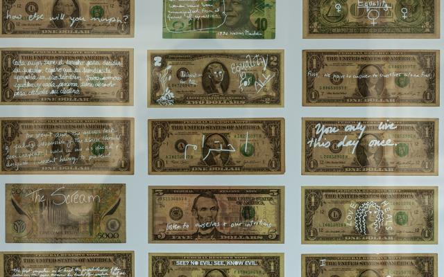 Dollar bills with messages written on them