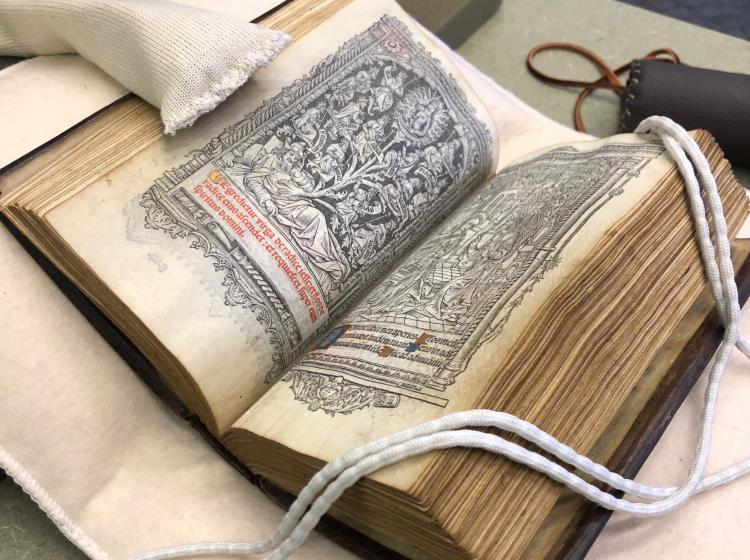A manuscript, open to a page with a woodcut illustration, in the PSU library's special collections