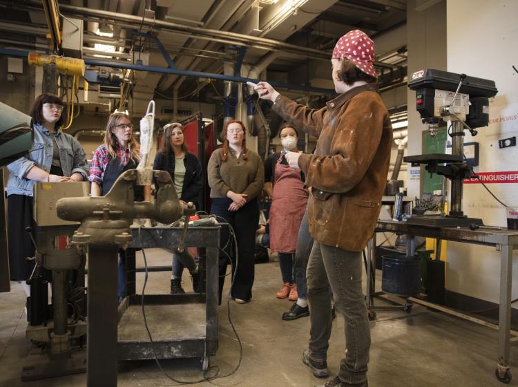 Instructor and students gathered in the metals shop