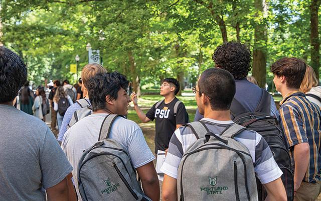 An orientation leader shows new students around the PSU Park Blocks.