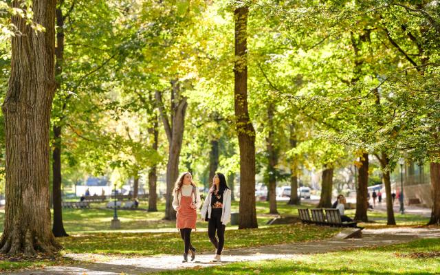 Two students walking in the Park Blocks