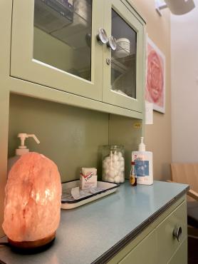Salt lamp on a green cabinet in the acupuncture room