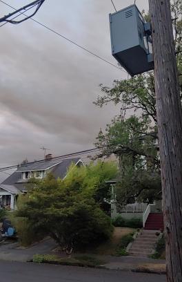Wildfire smoke extends over a southeast portland neighborhood