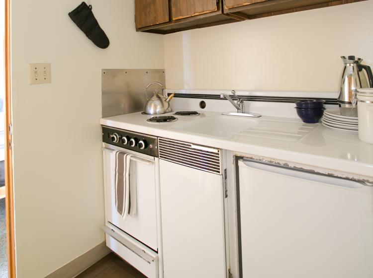 Kitchenette has stove, oven and mini fridge