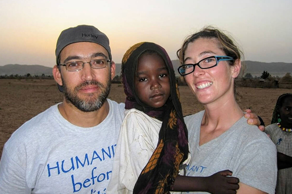 Katie-Jay Scott Stuaring with husband, Gabriel, and Darfuri refugee child