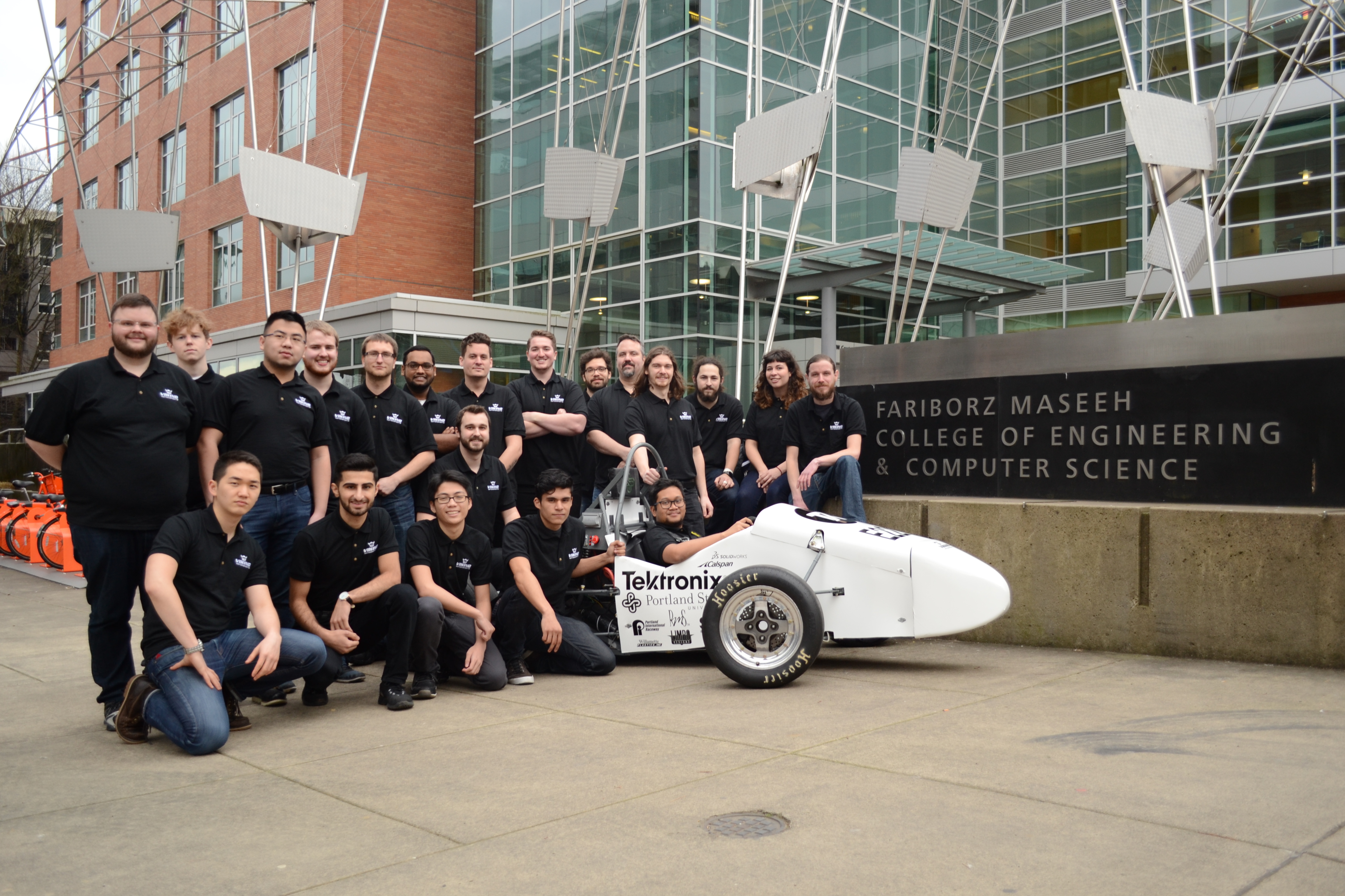 VMS team with car in front of Engineering Bulidng