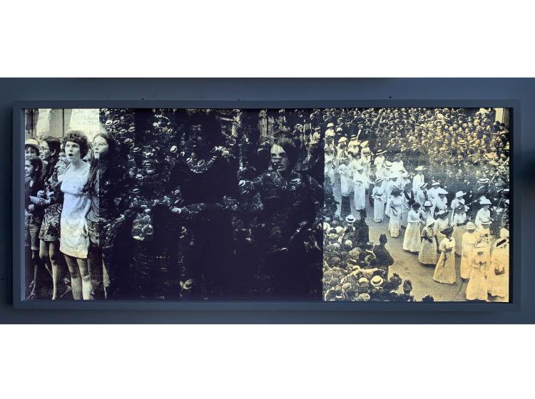 The artwork as it appears when lit by flash. Imagery is clearly visible, juxtaposing two archival images of women engaged in large protests. 