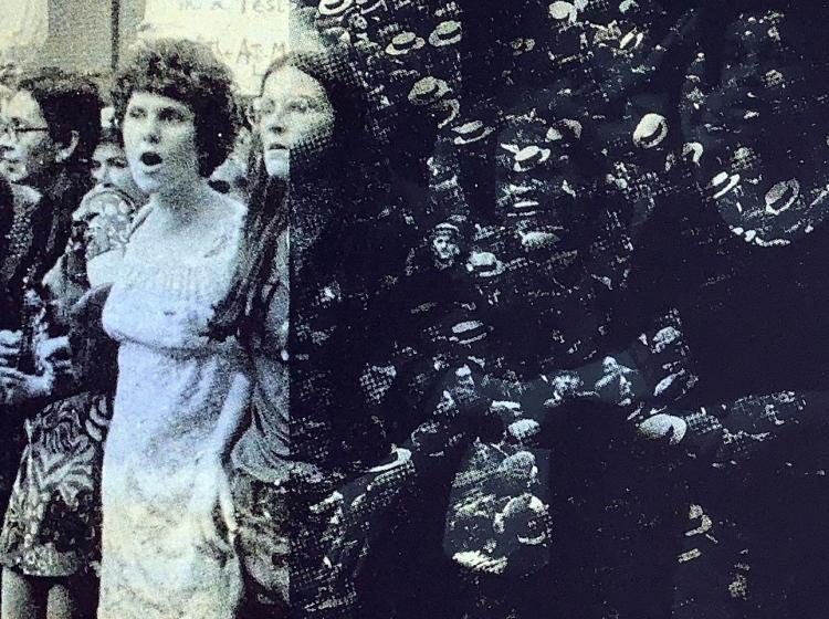 Detail of the print as it appears when lit by a flash. At left, two women can be seen. At right, a dense crowd of figures in hats.