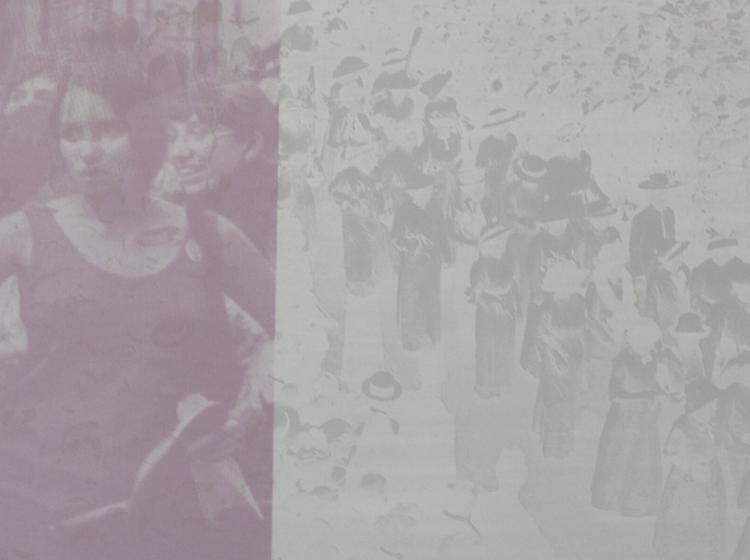 Detail of the print as it appears in normal light. At left, in pink, two women can be seen in a crowd; at left, in silver on white, a crowd of figures is barely visible.