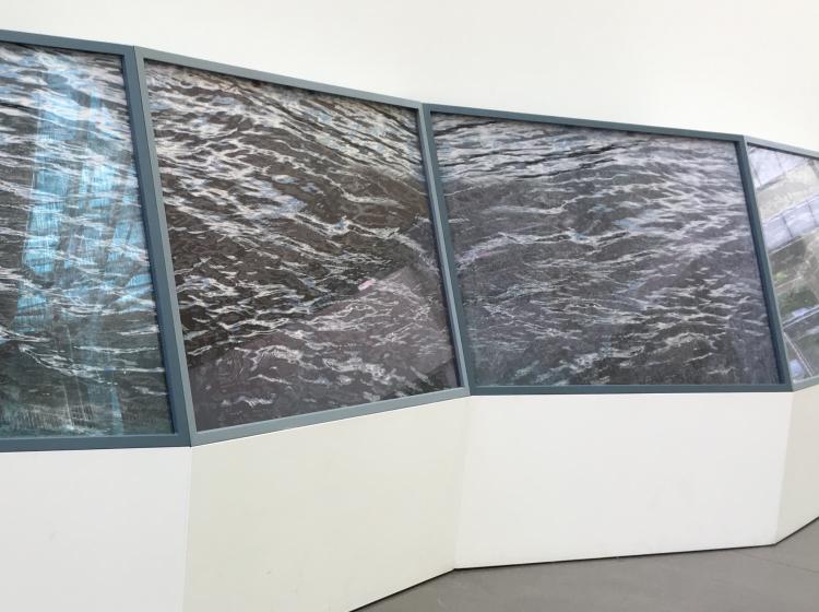 Close-up of the artwork viewed at an angle, focusing on the four embellished photos of rippling water.