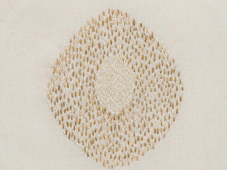 Detail image of Heather Watkins Opening. Ovular embroidery of white threads in the center and yellow threads surrounding