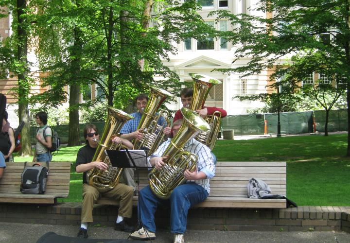 Students playing tubas in the park blocks.