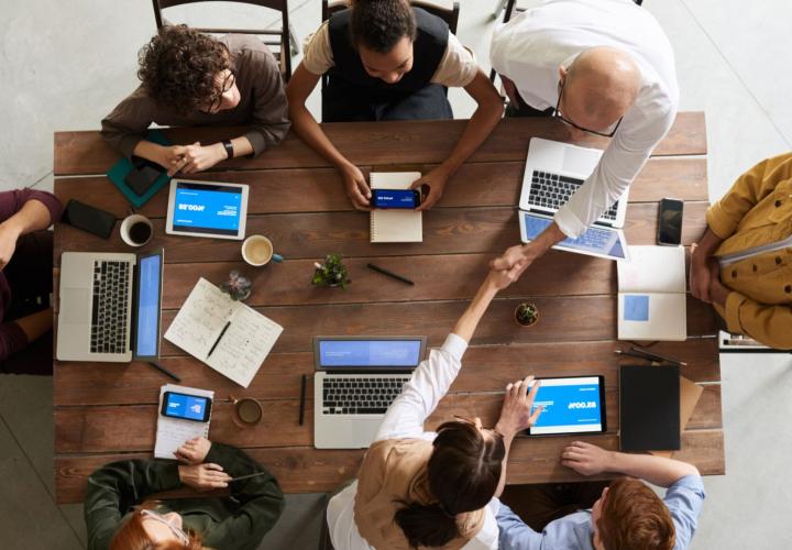 People shaking hands in a meeting