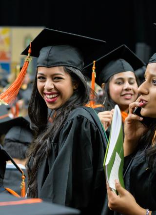 Photo of graduation day, PSU student smiling