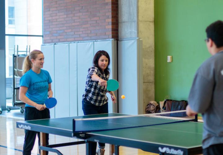 faculty/staff play table tennis in the Rec Center