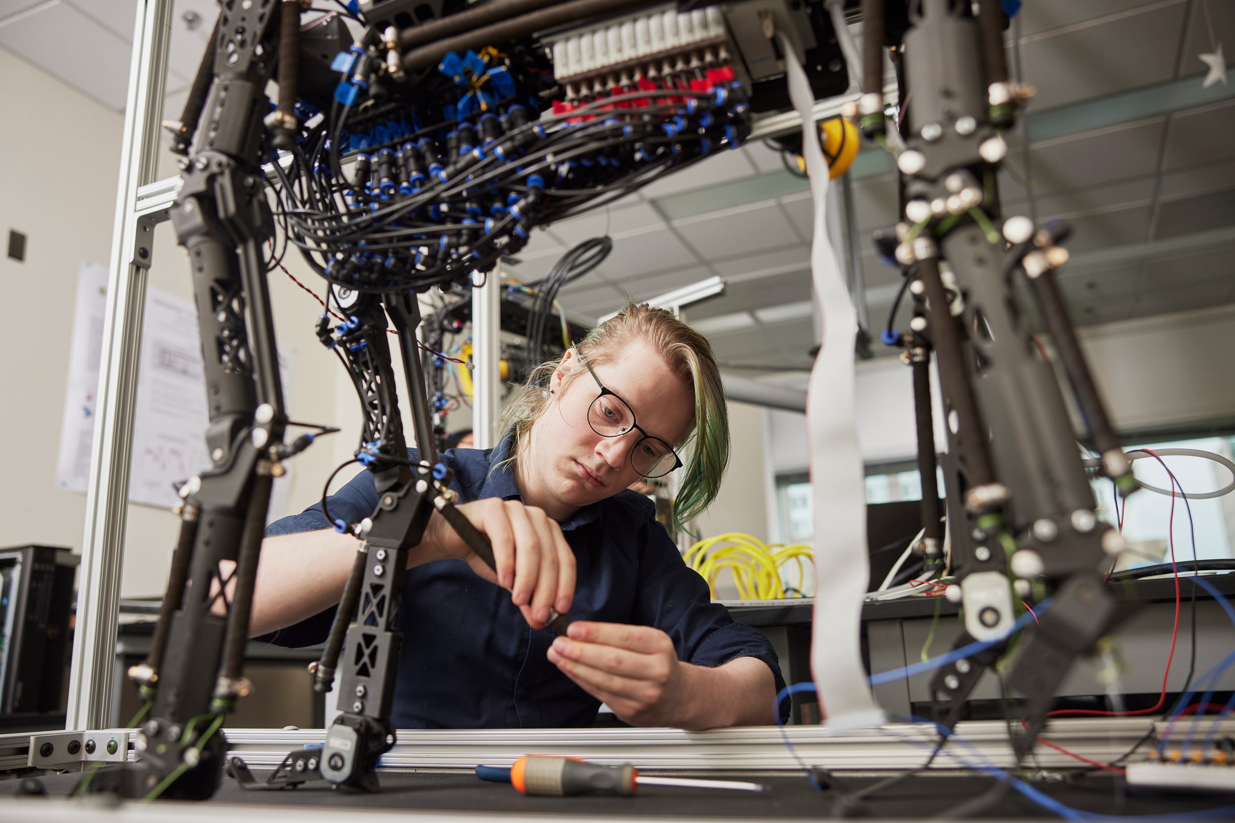 person working on robotics