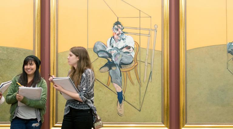 Three PSU art students at a museum
