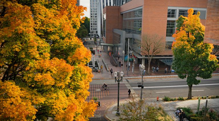 Fall colors on PSU's campus showing the campus rec building and 6th avenue. 