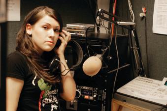 PSU student in the KSPU radio station broadcasting room