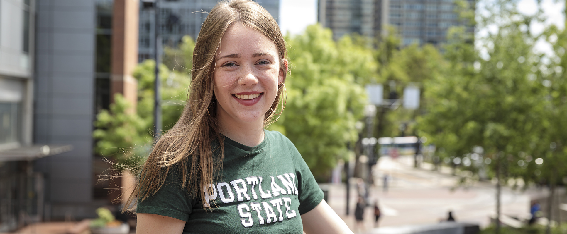 Portland State student relaxing in Urban Plaza