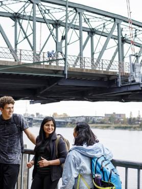 image of students in front of a bridge